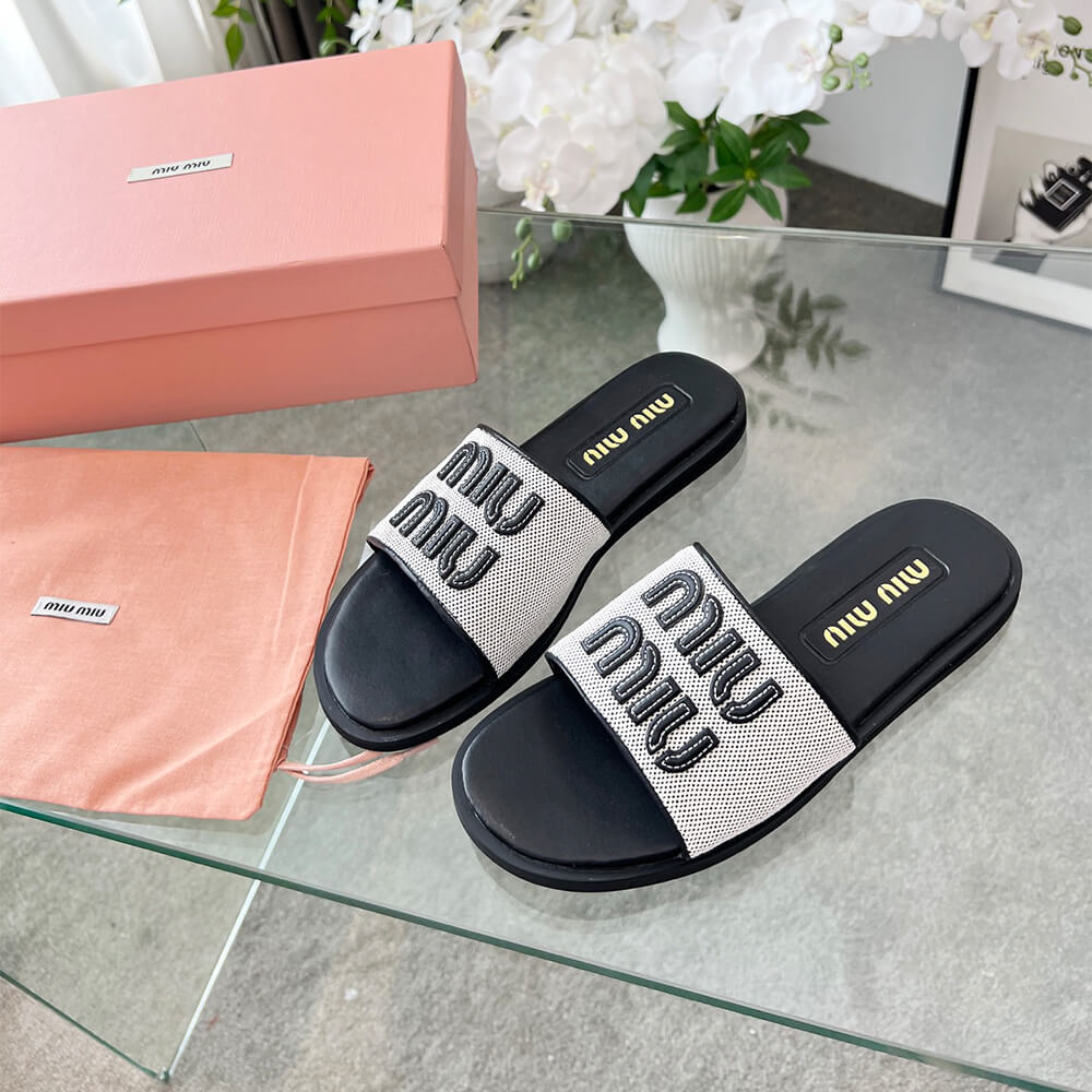 MiuMiu Canvas and leather slides