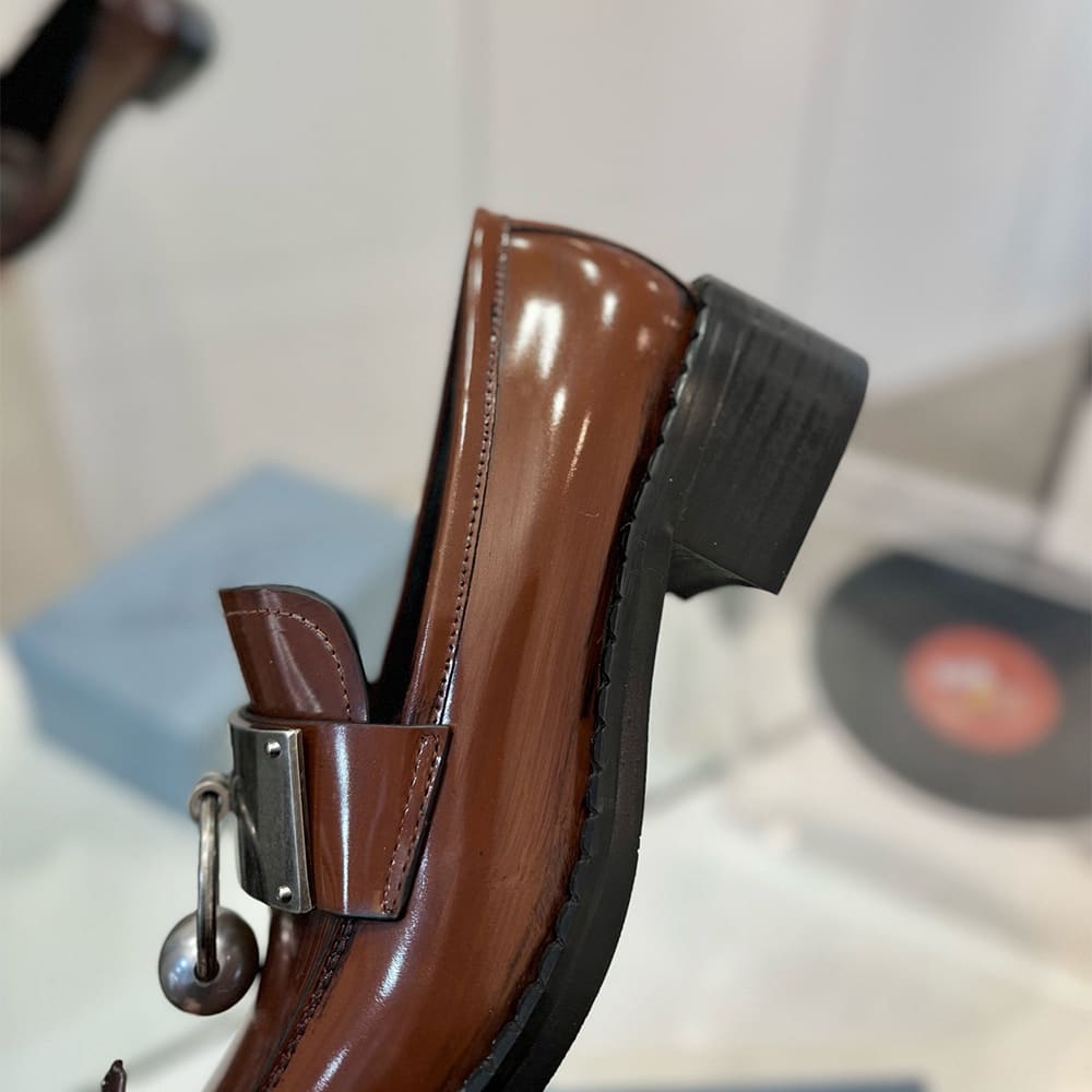 PRADA Brushed leather loafers with metal details